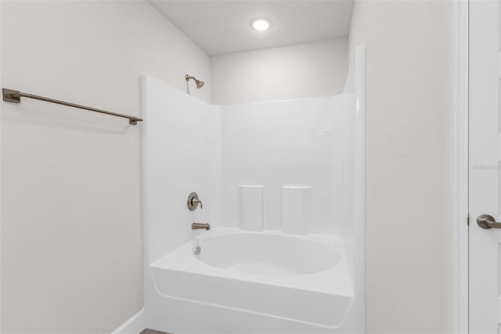 9500 Singer Circle Port Charlotte, FL 33981 - Photo 36 of 60 a bathroom with a bathtub