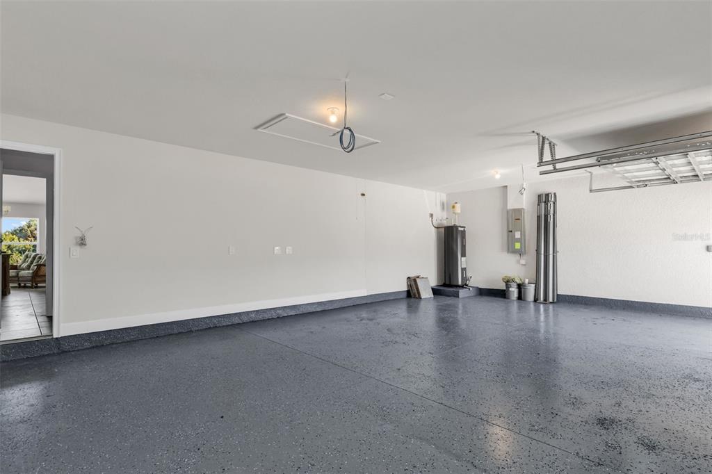 9500 Singer Circle Port Charlotte, FL 33981 - Photo 40 of 60 a view of empty room with wooden floor and ceiling fan
