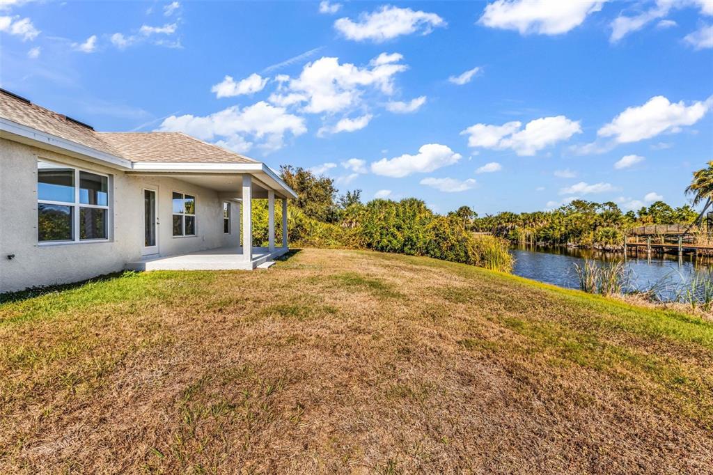 9500 Singer Circle Port Charlotte, FL 33981 - Photo 44 of 60 a view of a house with backyard and porch