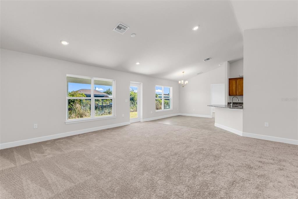 9500 Singer Circle Port Charlotte, FL 33981 - Photo 9 of 60 a view of an empty room with a window