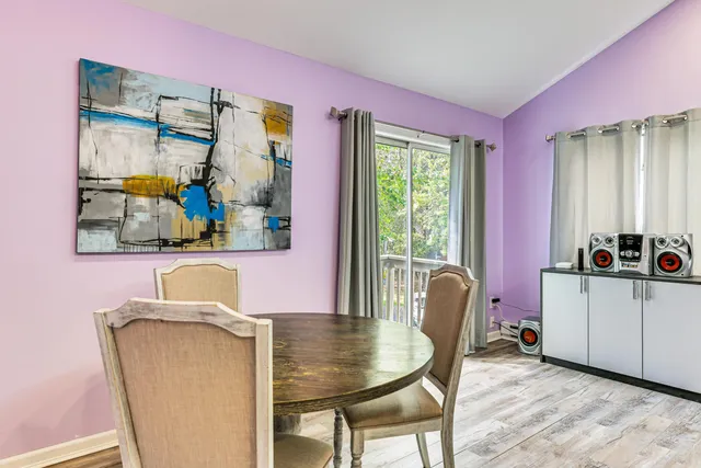 a dining room with furniture and window