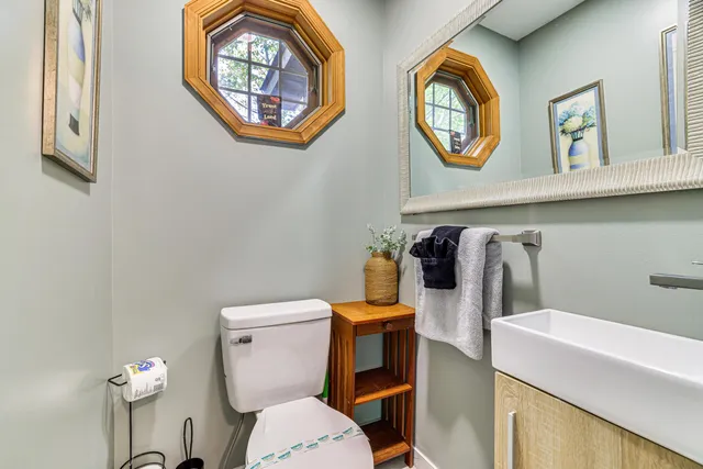 a bathroom with a toilet and a sink