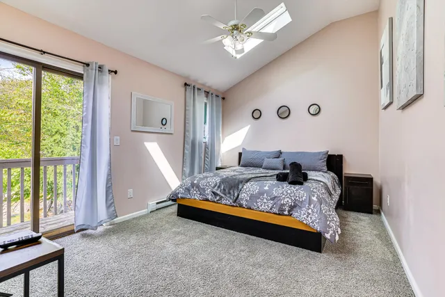 a bedroom with a bed dresser and a window