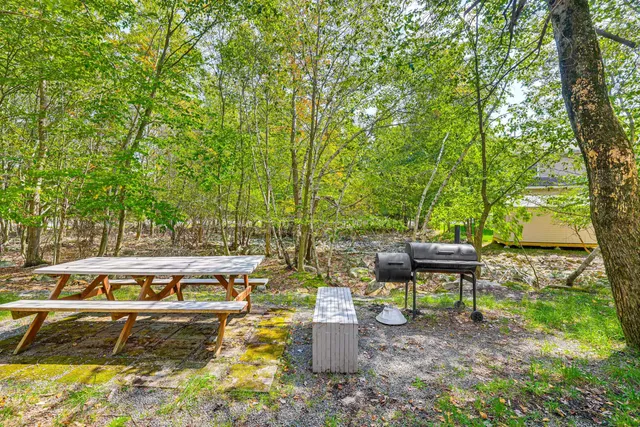 a view of a backyard with sitting area