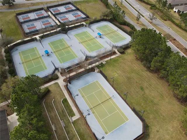 an aerial view of a house with a lake view