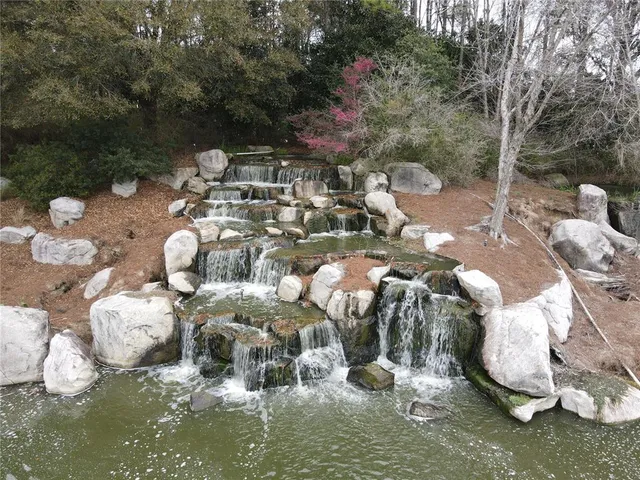 an aerial view of a house with a lake view