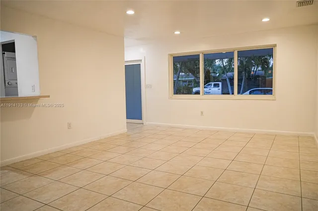 a view of an empty room and window