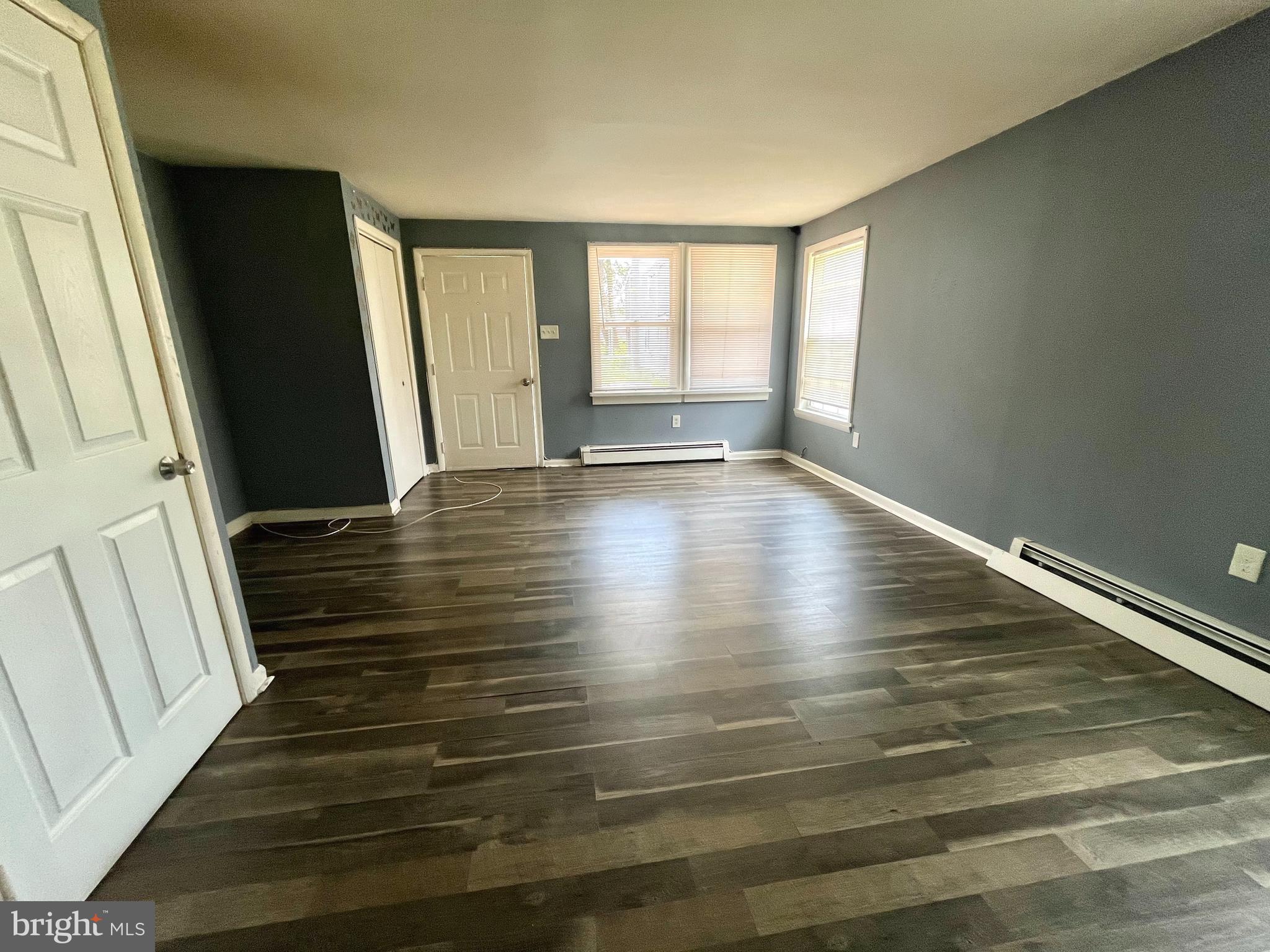 140 East Federal Street Burlington, NJ 08016 - Photo 2 of 18 a view of an empty room with wooden floor and window