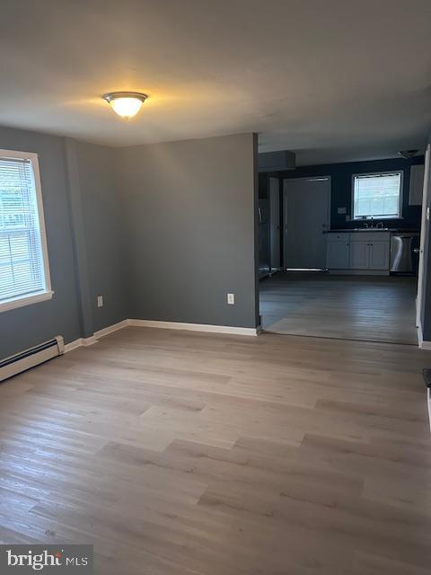 140 East Federal Street Burlington, NJ 08016 - Photo 5 of 18 en empty room with window and wooden floor