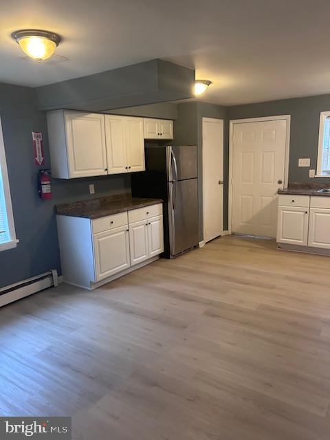 140 East Federal Street Burlington, NJ 08016 - Photo 7 of 18 a large kitchen with a refrigerator a stove a microwave and a counter space