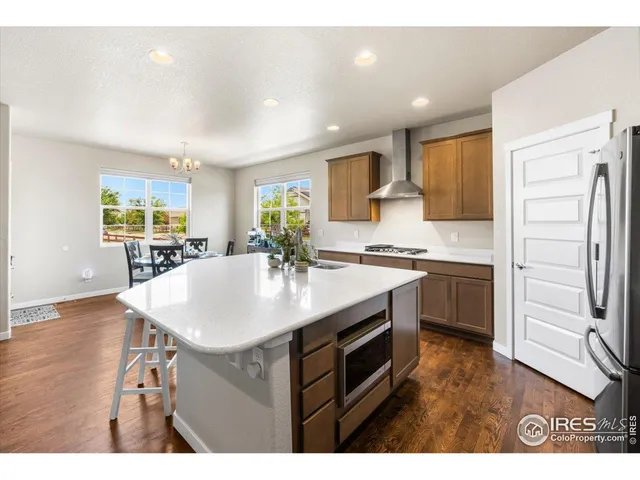 a kitchen with a sink stove and refrigerator