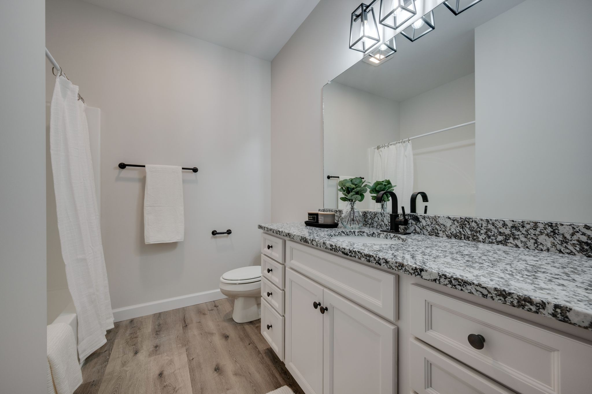 57 Truform Way Dickson, TN 37055 - Photo 16 of 29 a bathroom with a granite countertop sink a toilet and a mirror