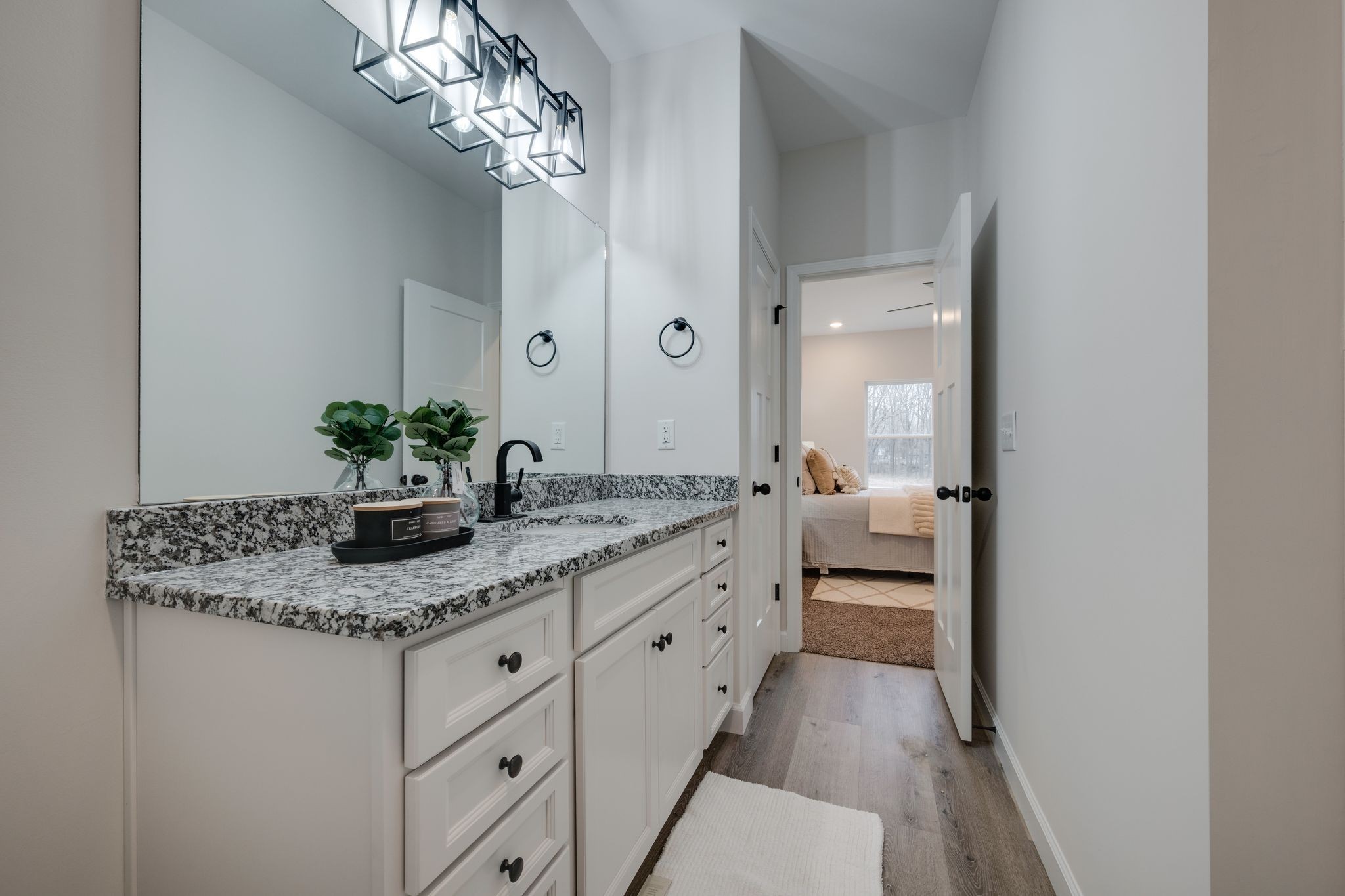 57 Truform Way Dickson, TN 37055 - Photo 17 of 29 a bathroom with a granite countertop double vanity and a mirror