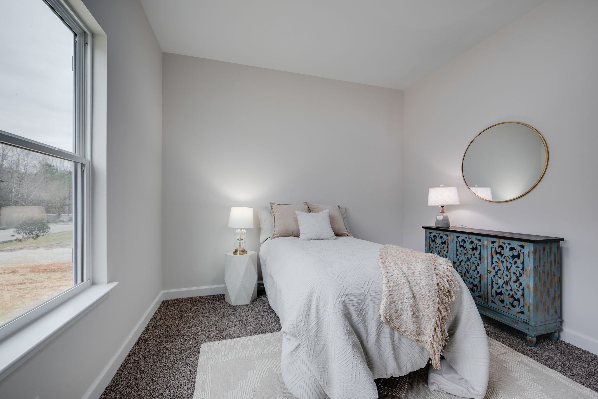 57 Truform Way Dickson, TN 37055 - Photo 19 of 29 a bedroom with a bed a mirror and a window