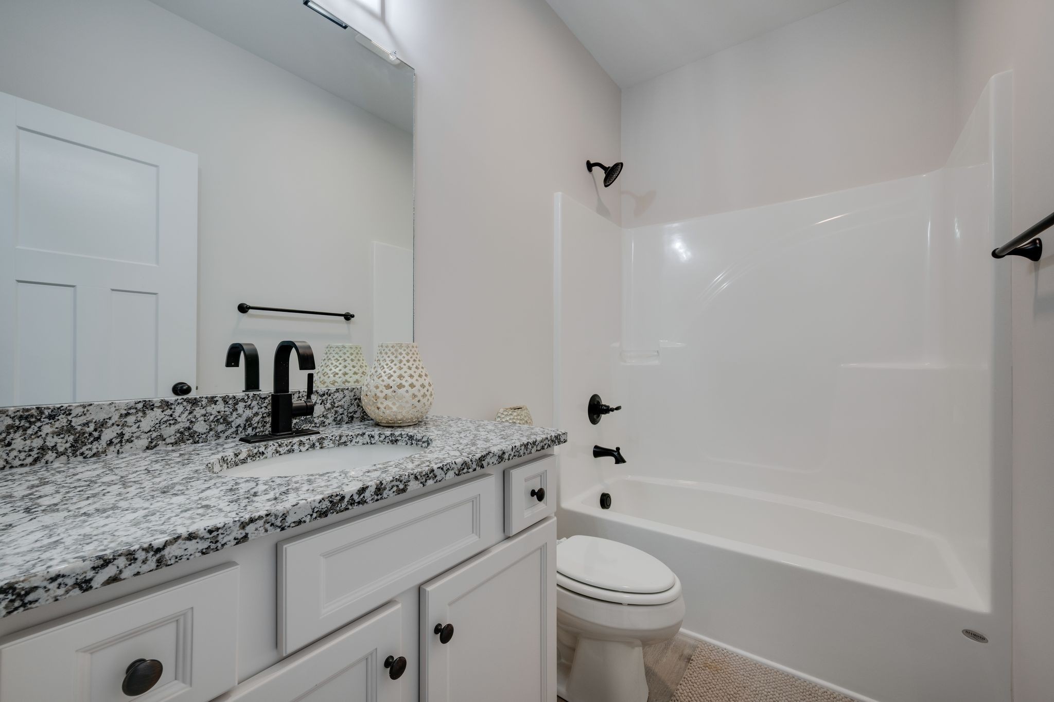 57 Truform Way Dickson, TN 37055 - Photo 20 of 29 a bathroom with a granite countertop sink a toilet and bathtub