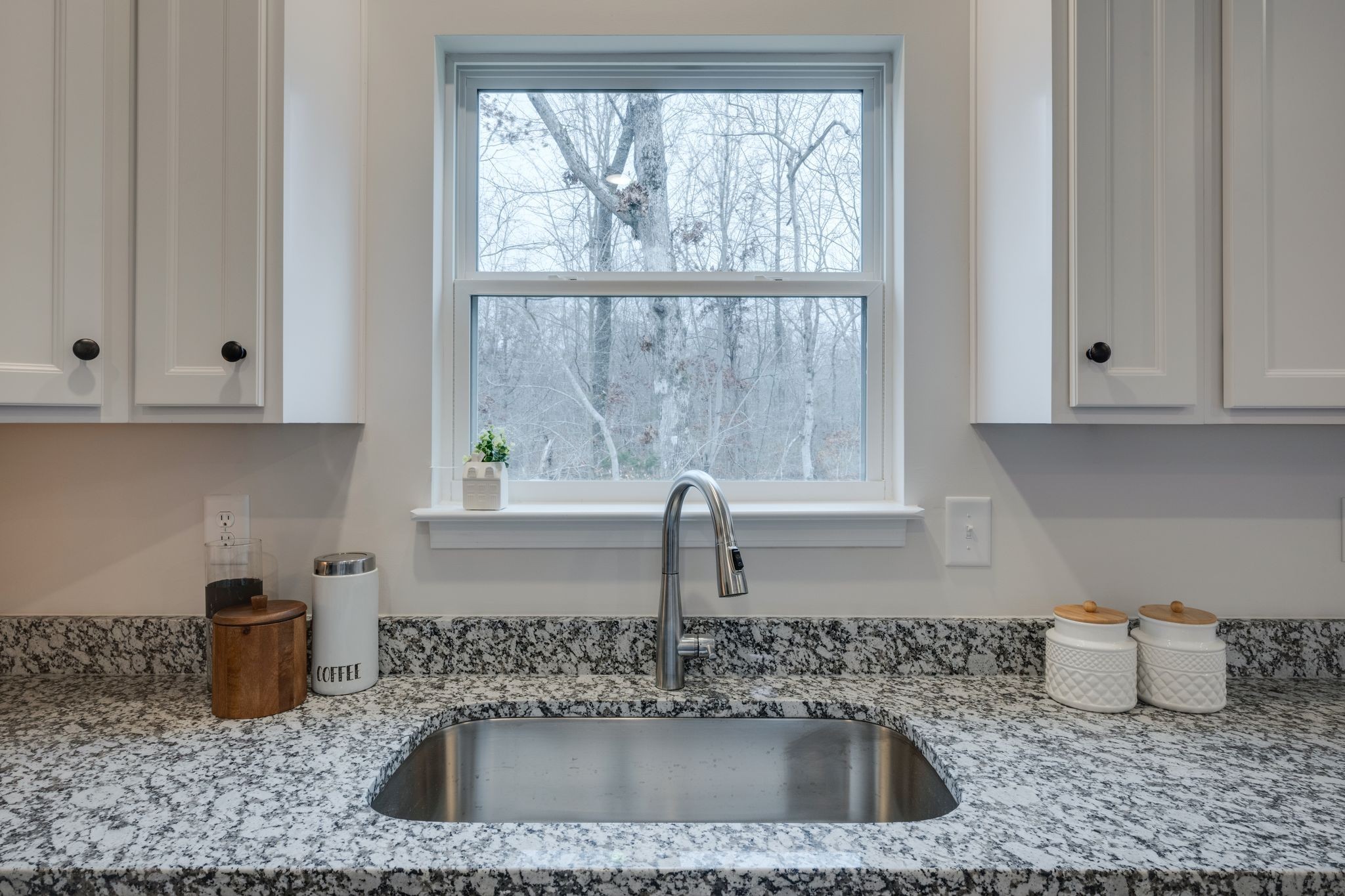 57 Truform Way Dickson, TN 37055 - Photo 9 of 29 a kitchen with granite countertop a sink window and cabinets