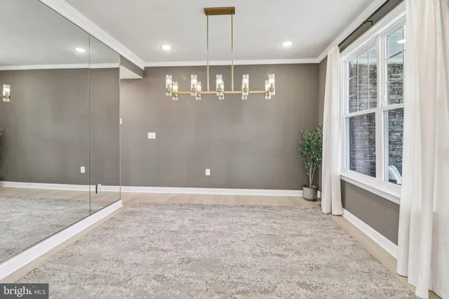 a kitchen with stainless steel appliances granite countertop a stove microwave and cabinets