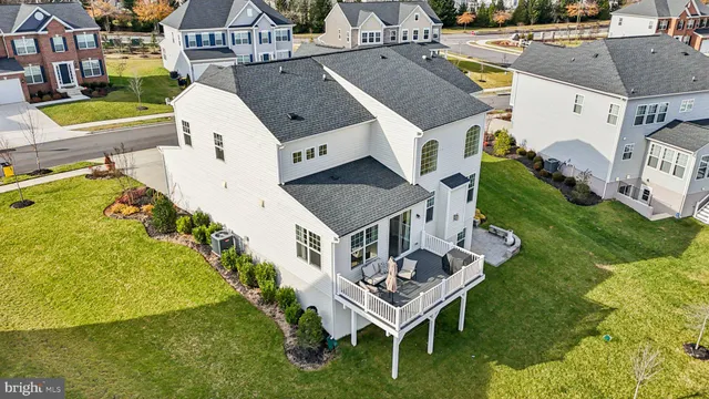 a front view of a house with a yard table and chairs