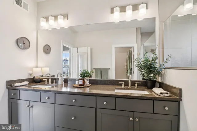 a view of a room with wooden floor and white walls