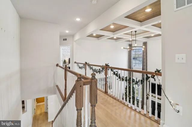 a living room with furniture window and a wooden floor