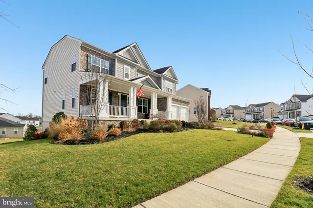 a view of a livingroom with furniture window and wooden floor