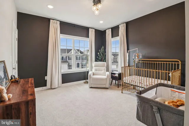 an aerial view of a house with a view of a yard and front view of a house