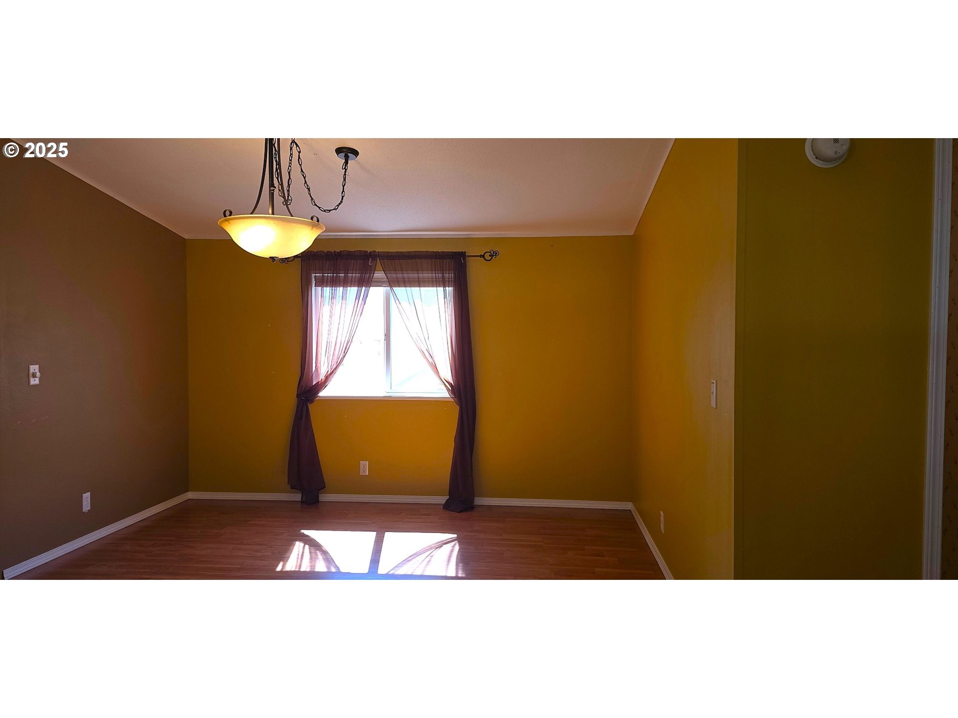 835 Southeast 1st Avenue, Unit 64 Canby, OR 97013 - Photo 19 of 37 a view of a room with a window and table
