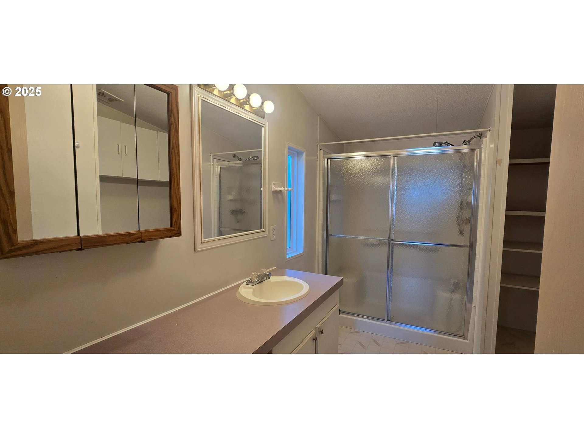 835 Southeast 1st Avenue, Unit 64 Canby, OR 97013 - Photo 23 of 37 a bathroom with a sink and a mirror