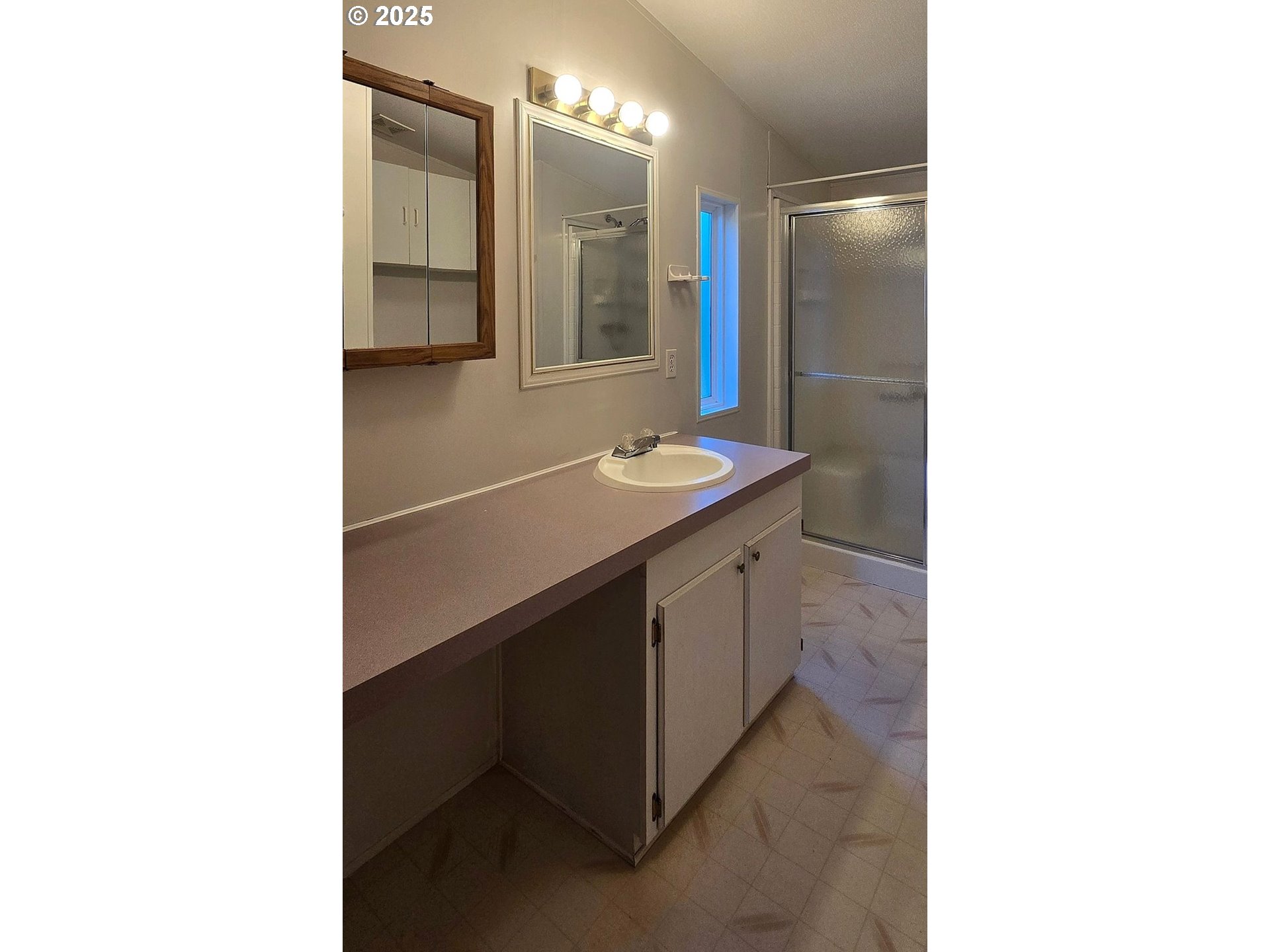 835 Southeast 1st Avenue, Unit 64 Canby, OR 97013 - Photo 25 of 37 a bathroom with a sink and a mirror