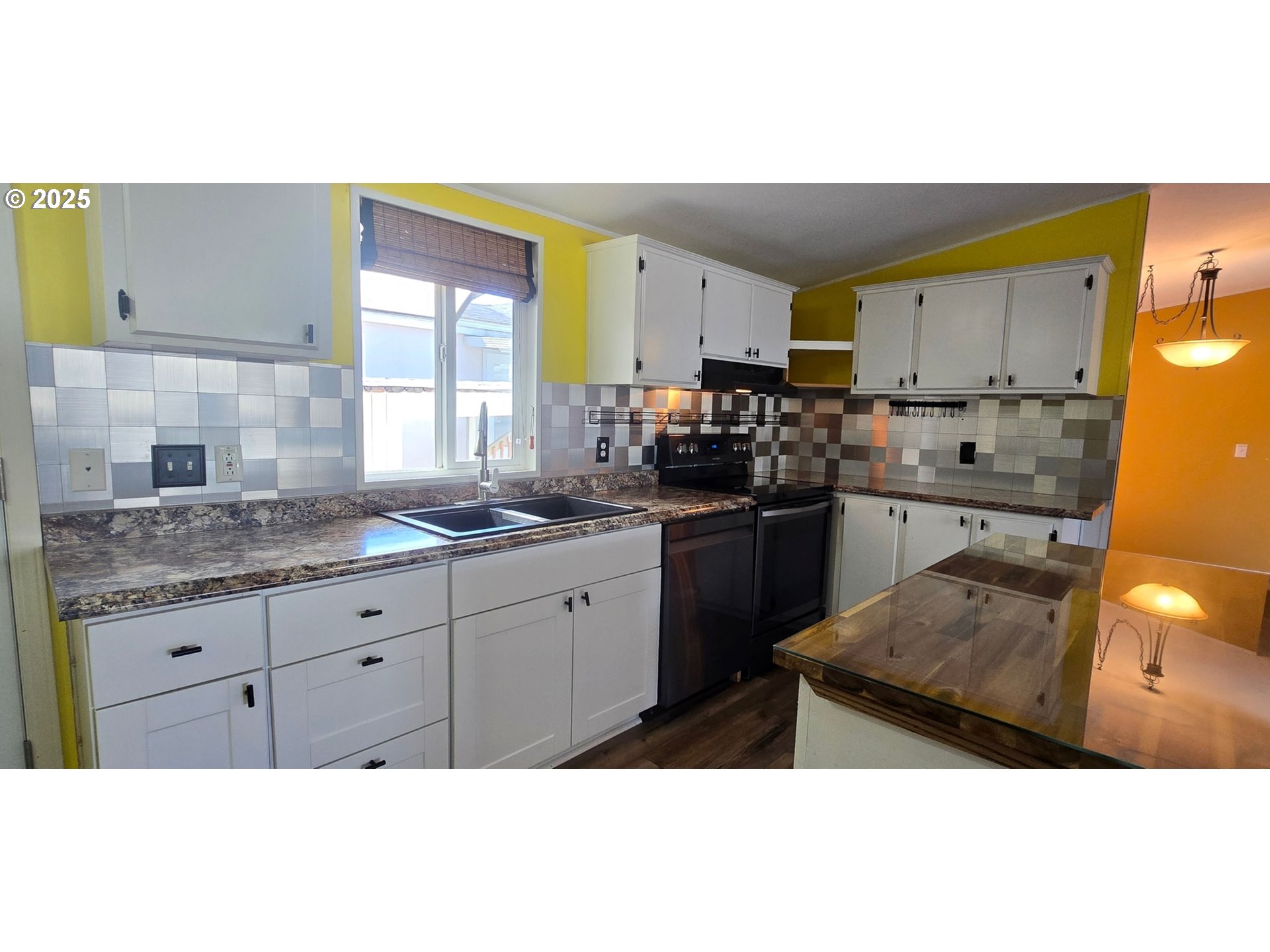 835 Southeast 1st Avenue, Unit 64 Canby, OR 97013 - Photo 5 of 37 a kitchen with a sink a stove and cabinets