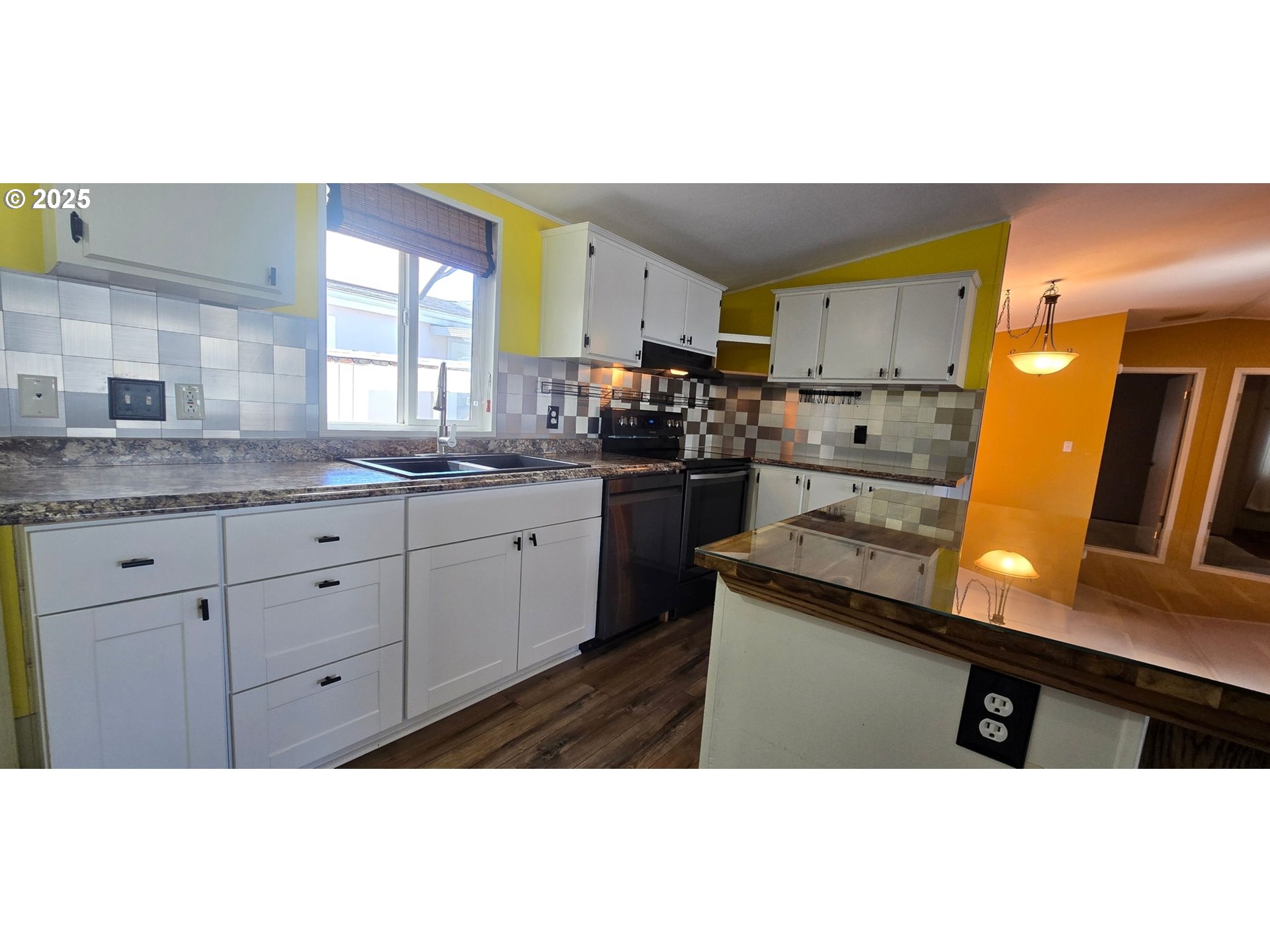 835 Southeast 1st Avenue, Unit 64 Canby, OR 97013 - Photo 6 of 37 a kitchen with stainless steel appliances granite countertop a sink a stove and a wooden floors
