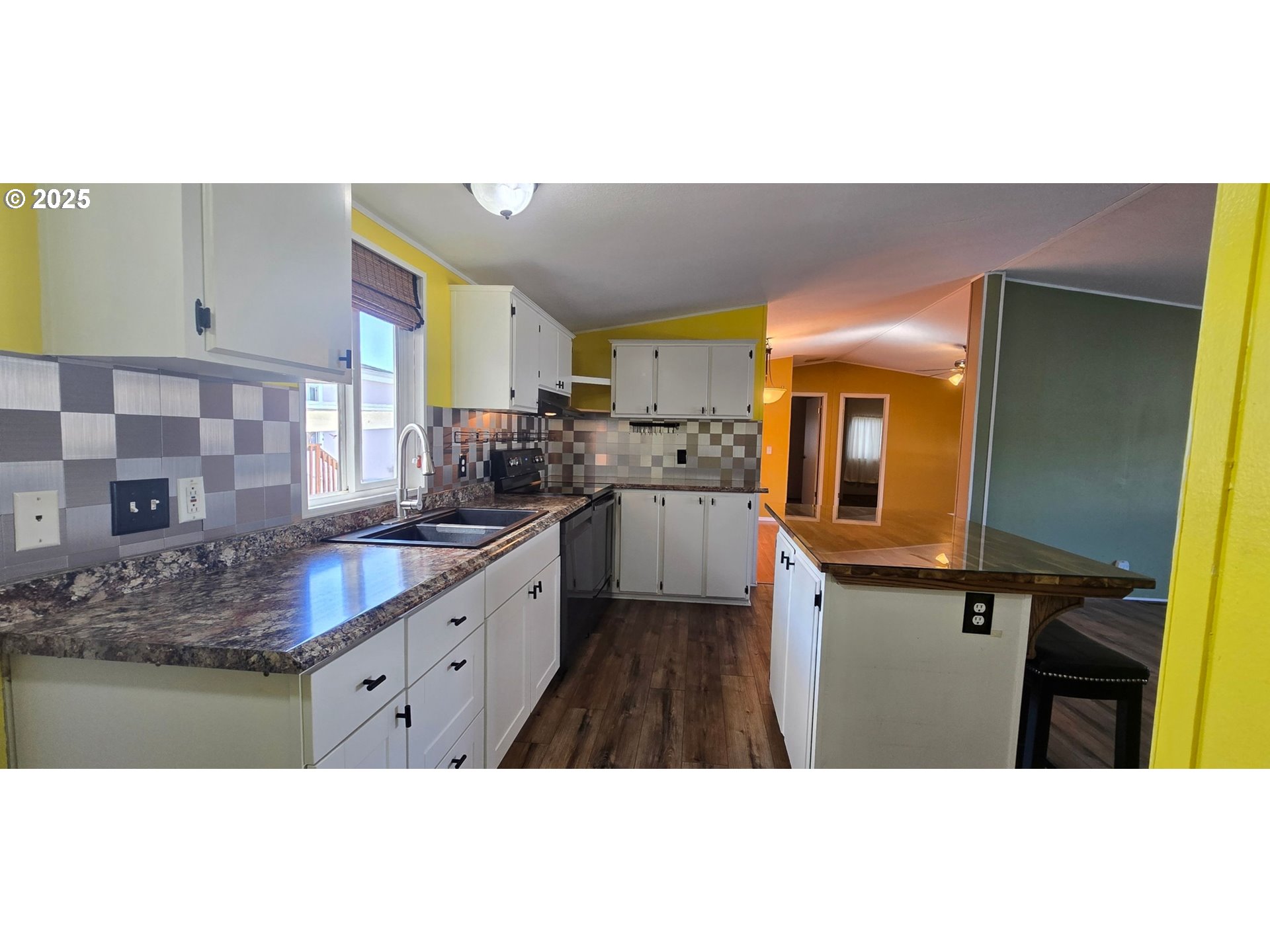835 Southeast 1st Avenue, Unit 64 Canby, OR 97013 - Photo 7 of 37 a kitchen view with granite countertop a sink and cabinets