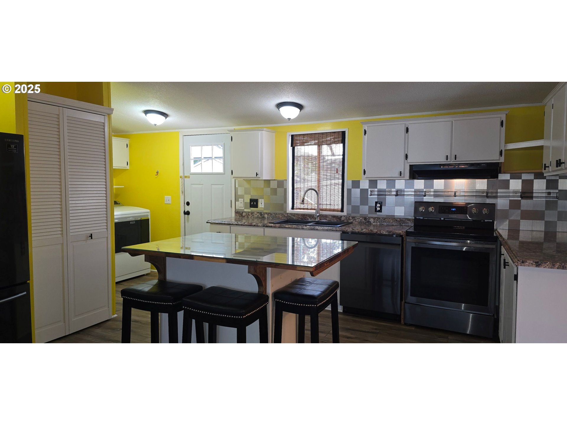835 Southeast 1st Avenue, Unit 64 Canby, OR 97013 - Photo 8 of 37 a kitchen with a sink cabinets and wooden floor