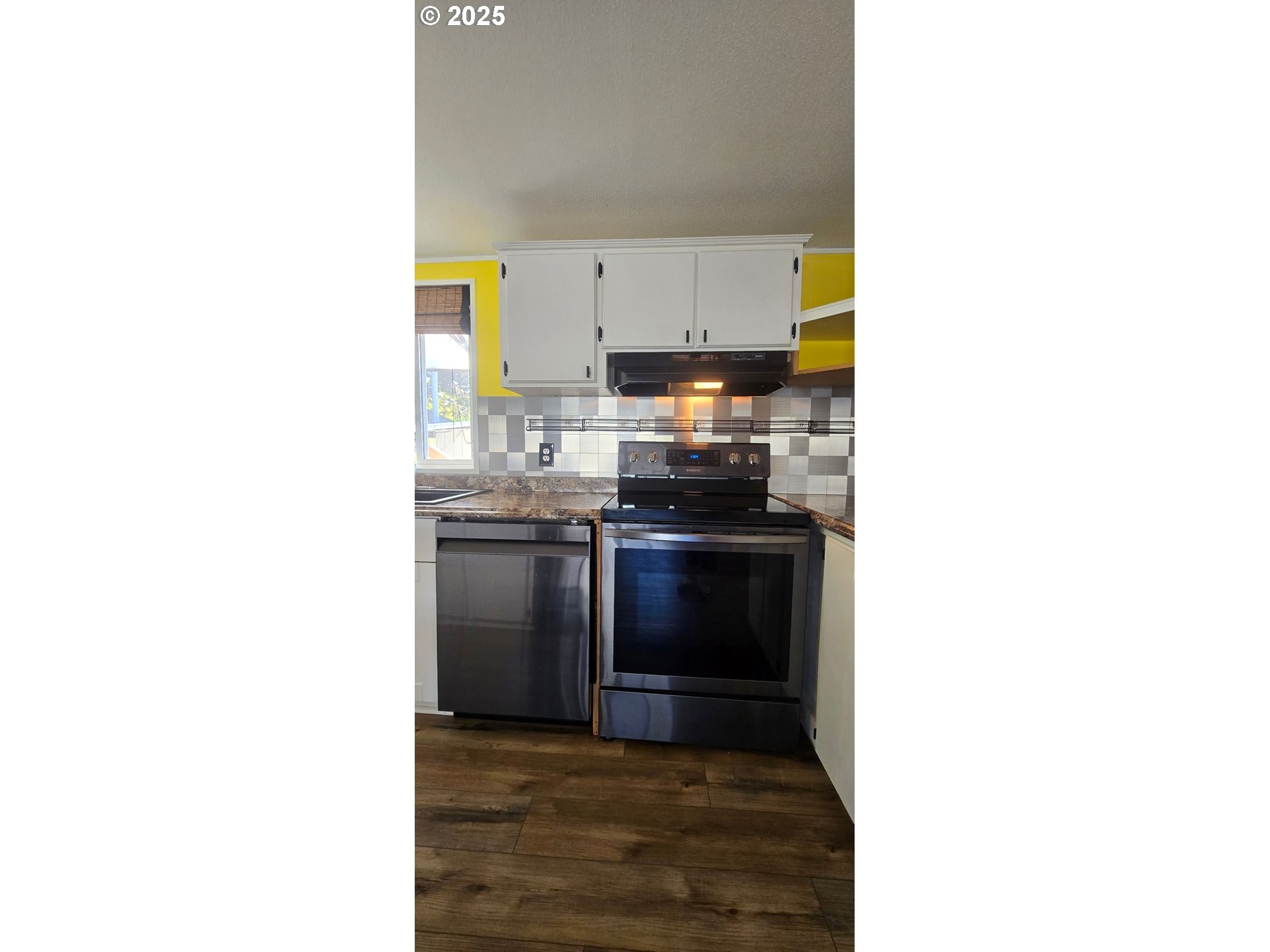 835 Southeast 1st Avenue, Unit 64 Canby, OR 97013 - Photo 10 of 37 a kitchen with a sink cabinets and stainless steel appliances