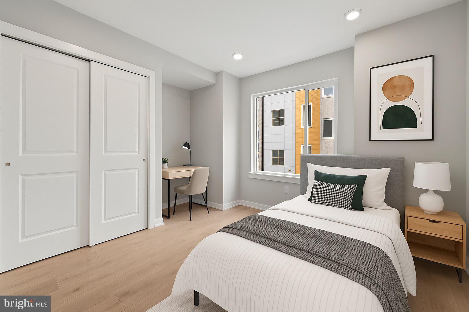 1432 Ogden Street, Unit 2 Philadelphia, PA 19130 - Photo 11 of 16 a bedroom with a bed and a painting on the wall