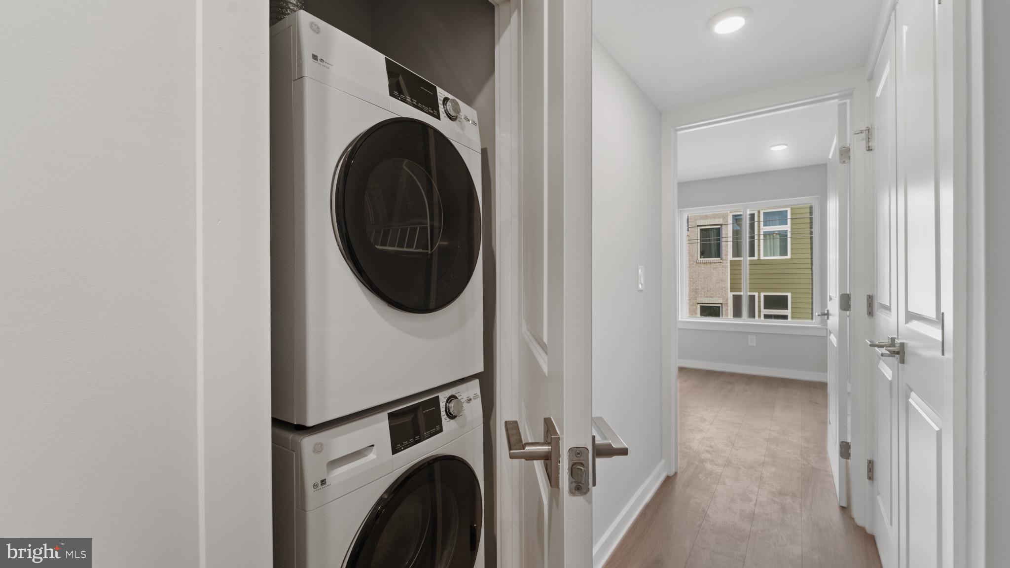 1432 Ogden Street, Unit 2 Philadelphia, PA 19130 - Photo 12 of 16 a view of a hallway with washer and dryer