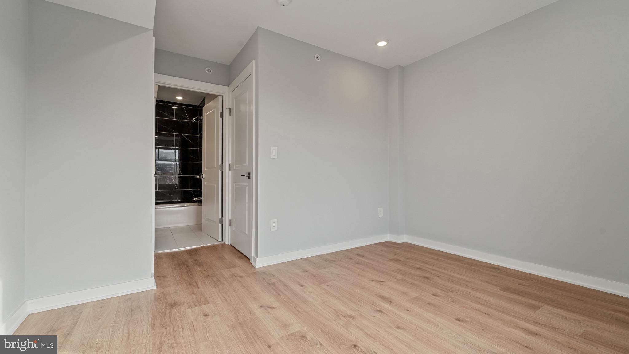 1432 Ogden Street, Unit 2 Philadelphia, PA 19130 - Photo 15 of 16 wooden floor in an empty room