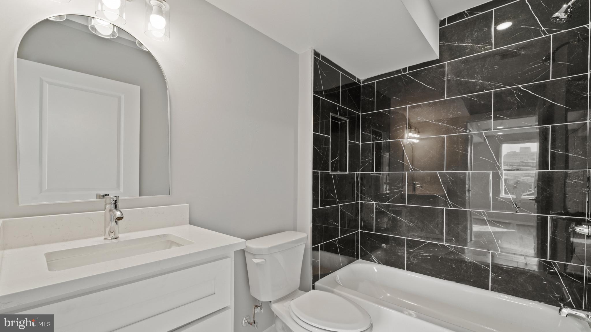 1432 Ogden Street, Unit 2 Philadelphia, PA 19130 - Photo 10 of 16 a bathroom with a sink toilet and shower