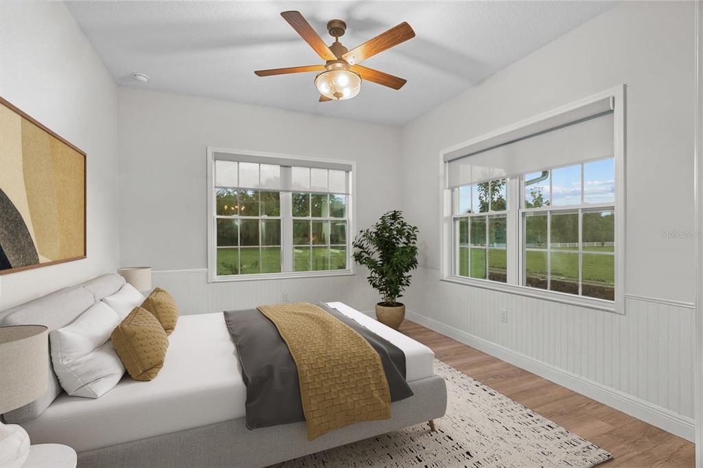 21679 Southwest 106th Lane Road Dunnellon, FL 34431 - Photo 11 of 88 a spacious bedroom with a bed and a large window