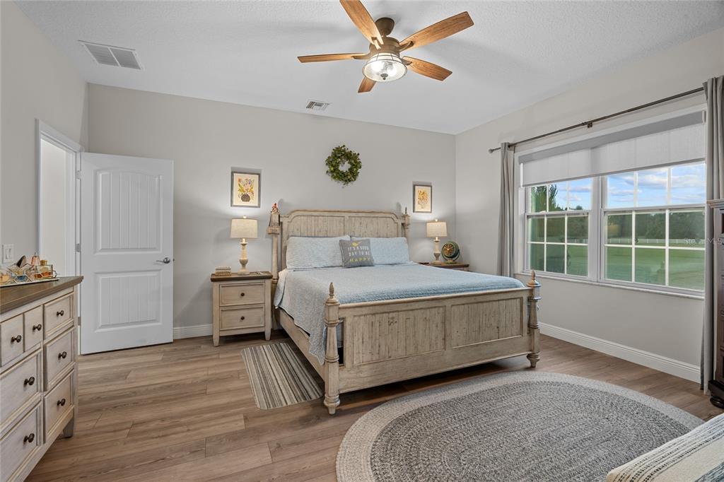 21679 Southwest 106th Lane Road Dunnellon, FL 34431 - Photo 24 of 88 a bedroom with a large bed and a window