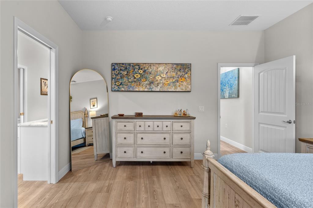 21679 Southwest 106th Lane Road Dunnellon, FL 34431 - Photo 26 of 88 a bedroom with a bed and a dresser in it