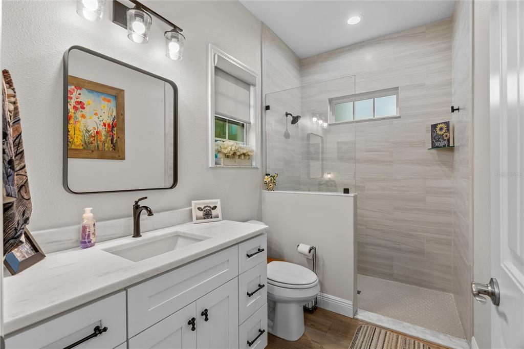 21679 Southwest 106th Lane Road Dunnellon, FL 34431 - Photo 32 of 88 a bathroom with a toilet sink and mirror
