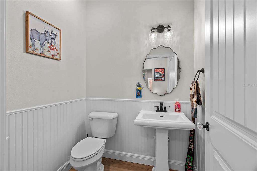 21679 Southwest 106th Lane Road Dunnellon, FL 34431 - Photo 36 of 88 a bathroom with a toilet sink and mirror