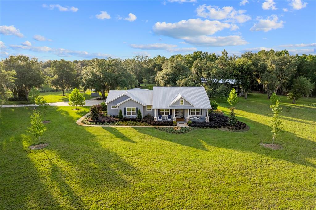 21679 Southwest 106th Lane Road Dunnellon, FL 34431 - Photo 4 of 88 a view of a house with a big yard