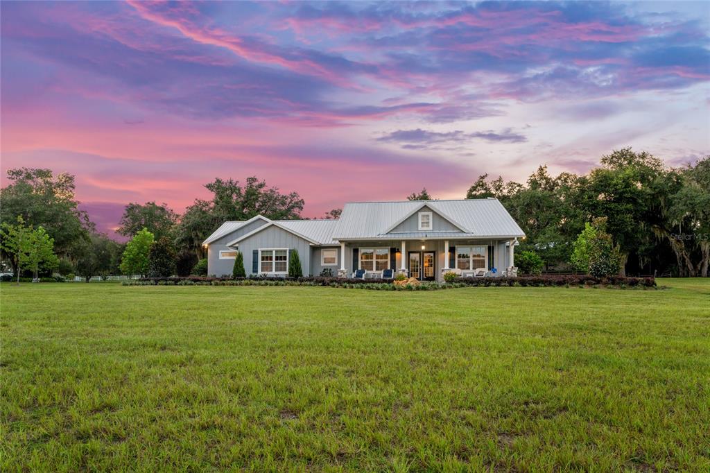 21679 Southwest 106th Lane Road Dunnellon, FL 34431 - Photo 68 of 88 a front view of a house with a garden