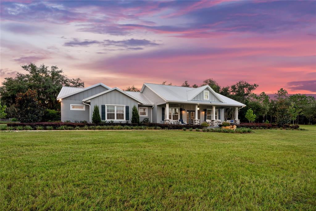 21679 Southwest 106th Lane Road Dunnellon, FL 34431 - Photo 71 of 88 a front view of a house with a garden