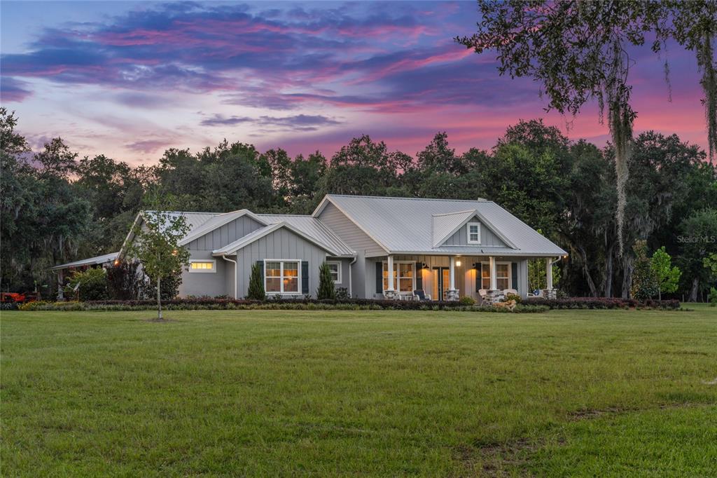 21679 Southwest 106th Lane Road Dunnellon, FL 34431 - Photo 73 of 88 a front view of a house with a garden