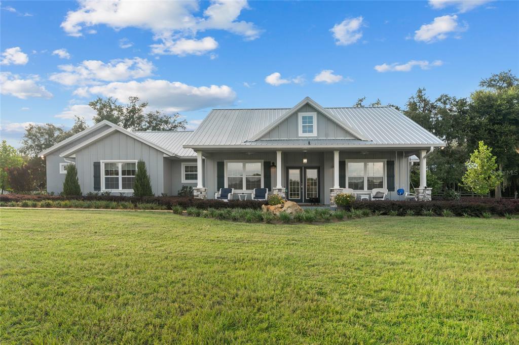 21679 Southwest 106th Lane Road Dunnellon, FL 34431 - Photo 76 of 88 a front view of a house with garden