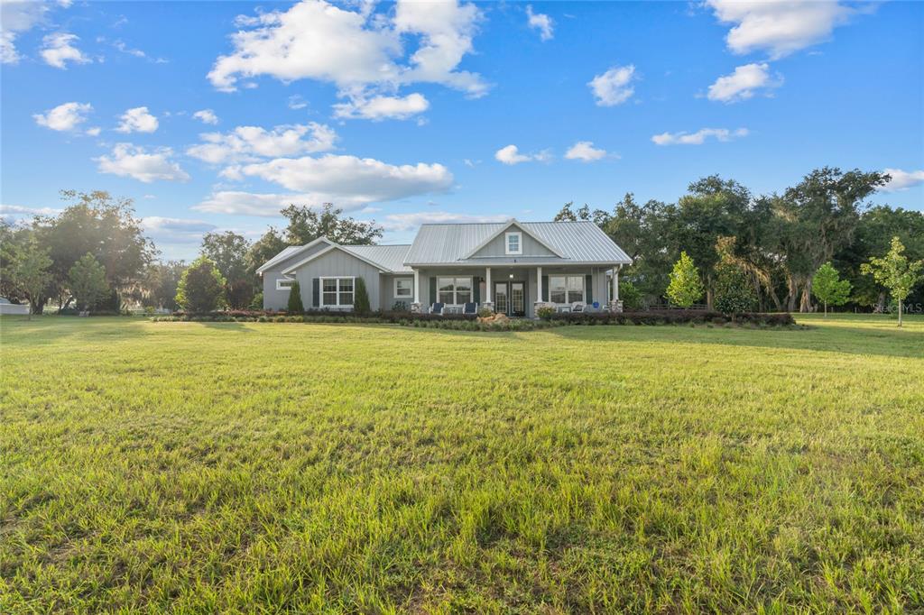 21679 Southwest 106th Lane Road Dunnellon, FL 34431 - Photo 79 of 88 a view of a house with a big yard