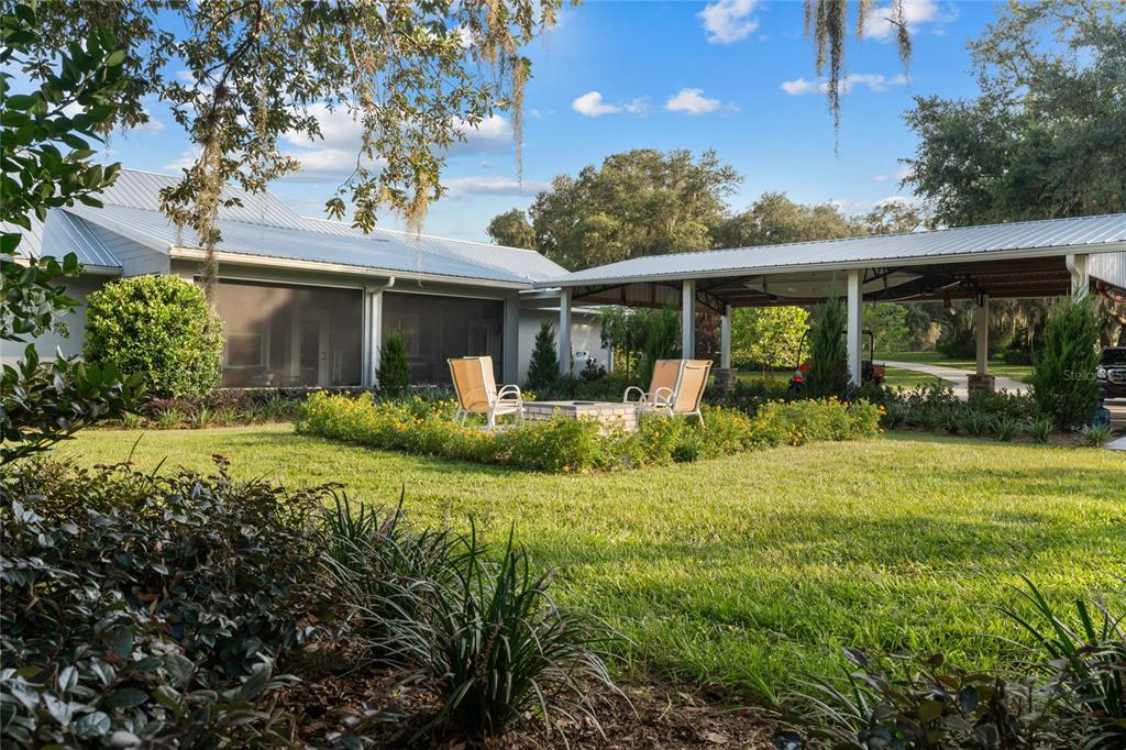 21679 Southwest 106th Lane Road Dunnellon, FL 34431 - Photo 80 of 88 a front view of a house with garden